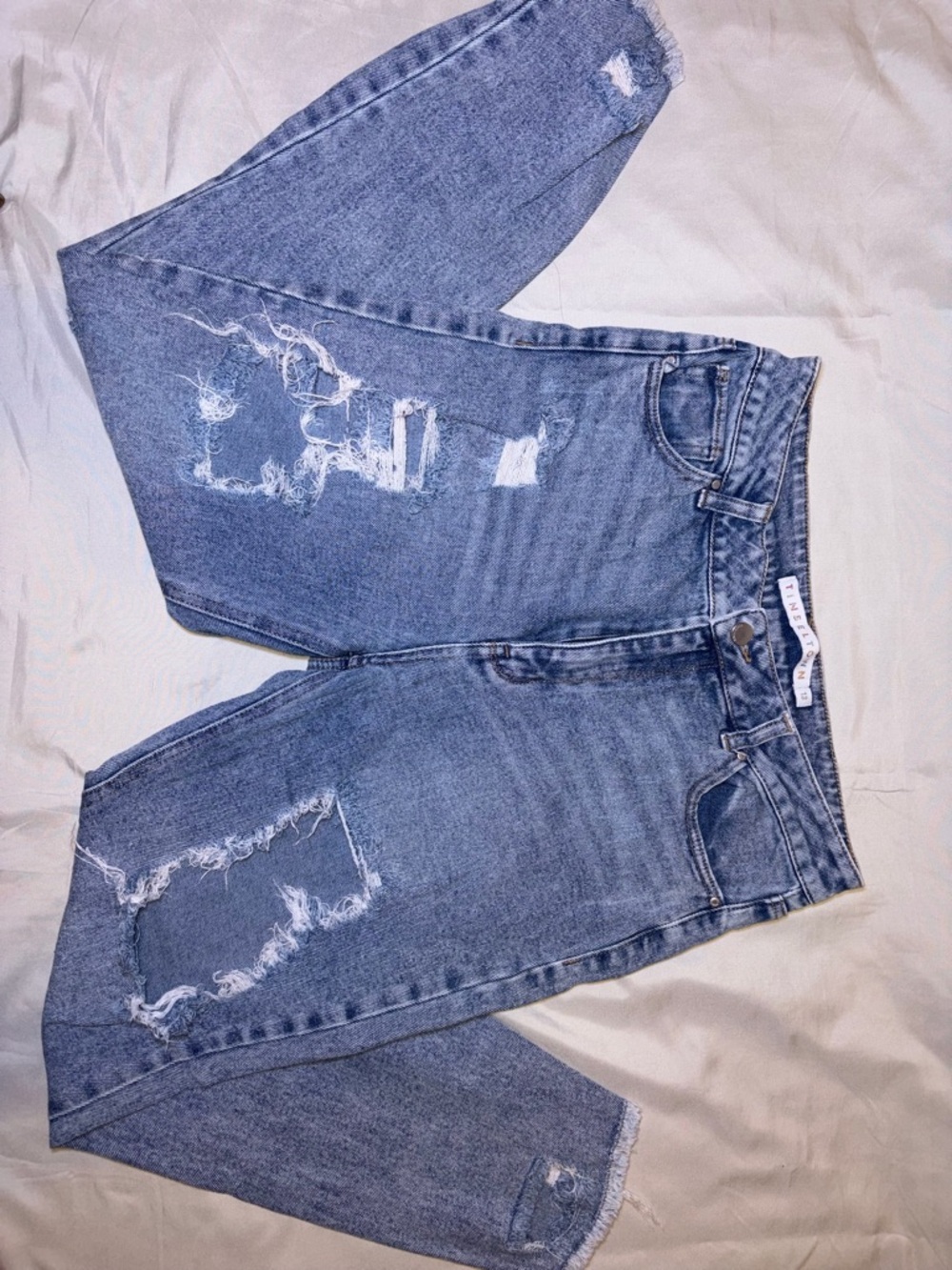 High-Rise Distressed Light Blue Denim Jeans